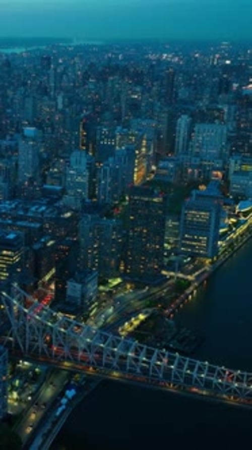 New York city in lights in the evening time. Lively and vibrant city from aerial perspective