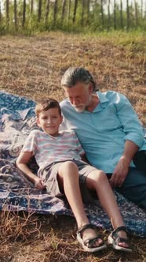 Grandfather and Grandson Enjoying a Sunny Day
