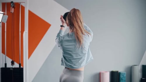 Woman Exercising in Gym