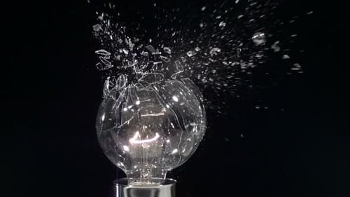 Lightbulb shatters in super slow motion after slingshot impact filmed on phantom camera