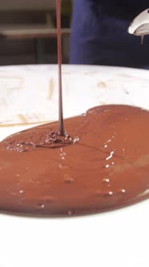 Mixing Chocolate for Signature Desserts in a Restaurant Haute Cuisine and Pastry Concept Vertical