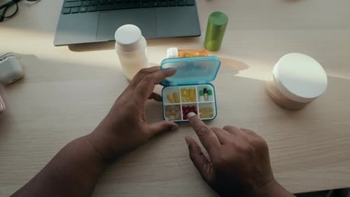 Woman Showing Pill Organizer