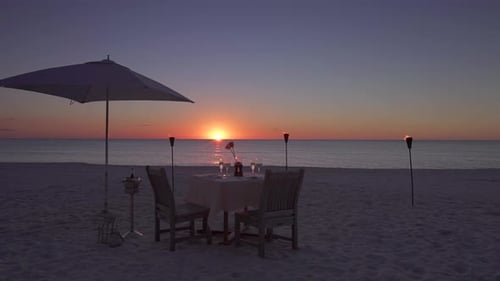 Romantic Table on the Beach Set for Two at Sunset Tracking