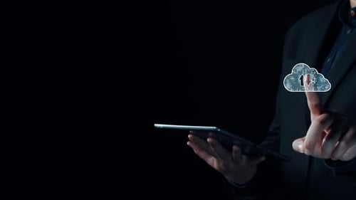 Person holding tablet with cloud storage symbol and data transfer icons in a dark background, illust