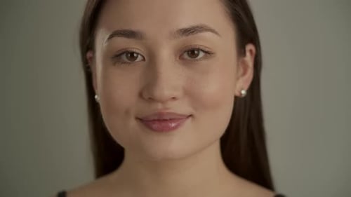Beautiful Young Woman Smiling in Close-Up Portrait