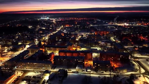 City lights illuminating winter evening during a beautiful sunset or twilight, aerial view