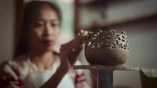 Woman Smoothing Decorative Ceramic Vase
