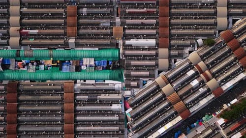 Slowly Gliding Over Bustling Stalls and Metal Rooftops of Vibrant Asian Market Capturing Lively