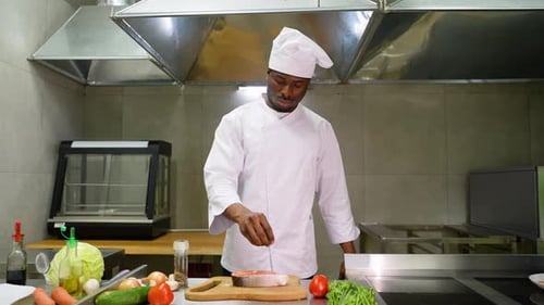 Chef Prepares Salmon in Commercial Kitchen