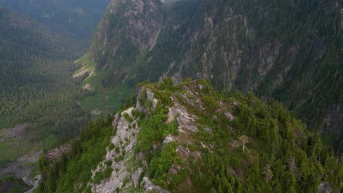 Aerial Cinematic View of Rocky Mountain Landscape Cloudy Sunny Day Taken in BC Canada