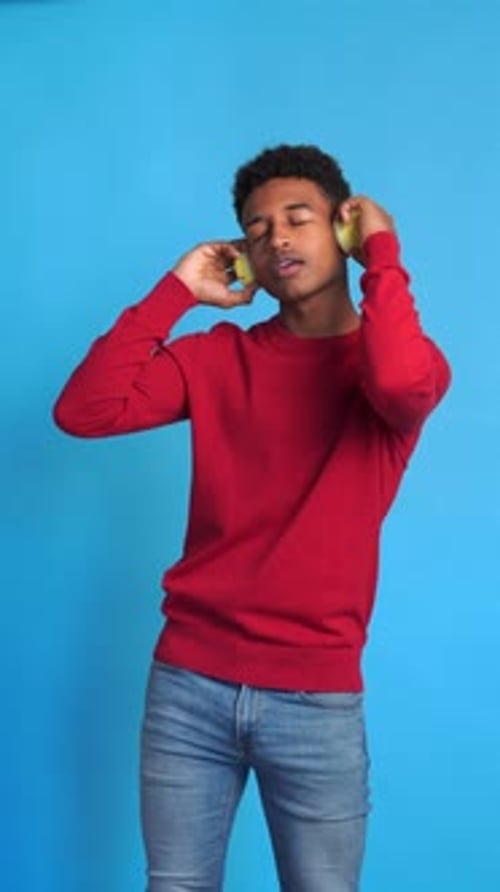 Man Dancing to Music Wearing Headphones