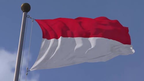 Realistic Waving Flag of Indonesia Against Blue Sky
