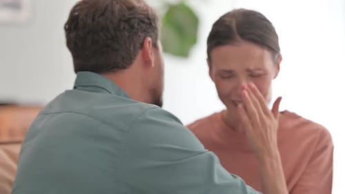 Woman Cries and Receives a Comforting Hug