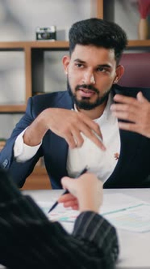 Woman and Man Business Partners Managers Discussing Working Issues Communicate in Office Diverse