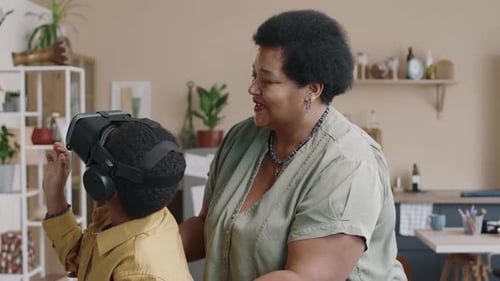 Child Using VR Headset with Adult Supervision