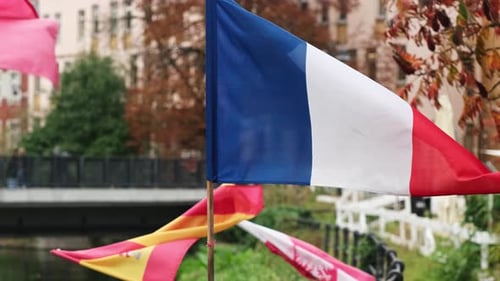 French Flag Waving in a City