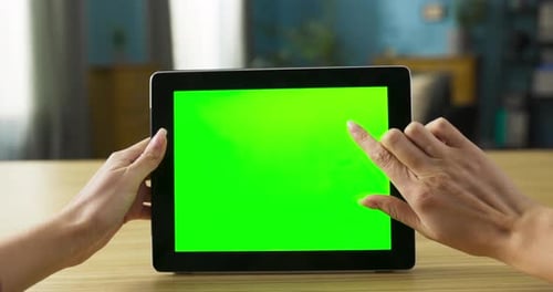 Woman Using Tablet with Chroma Key Screen