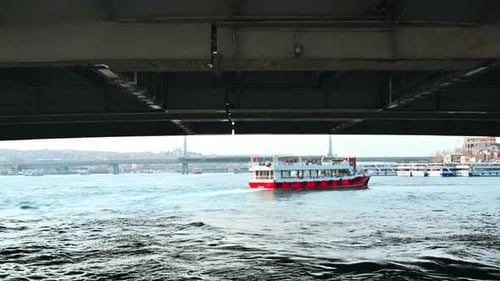 View of Bosporus strait from a ship floating under a bridge in Istanbul, Turkey. Floating boat, city