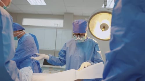 Surgeons Performing Surgery in Hospital Operating Room