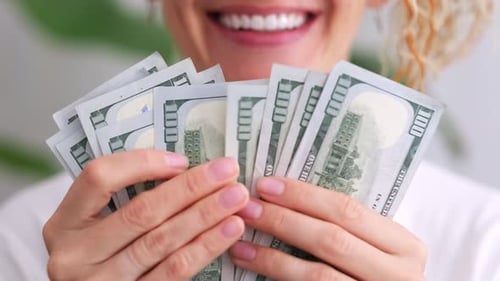 Excited Smiling Woman Showing Cash Money 1000 American Dollars Banknotes Hands with Money Close Up