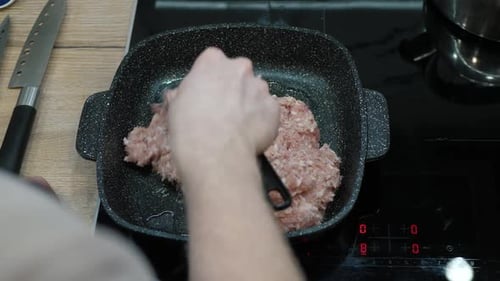 Cooking Ground Meat in a Kitchen Pan