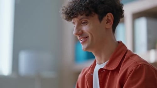 Young Adult Talking on Video Conference at Home