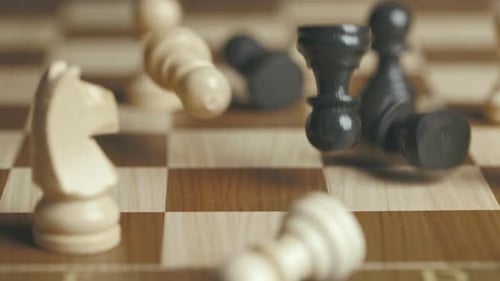 Chess Pieces Fall on a Pawn
