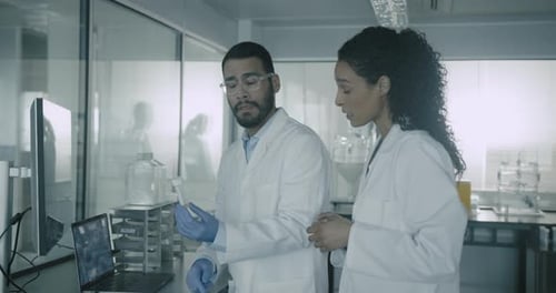 Scientists Examine Sample in Lab for Medical Research