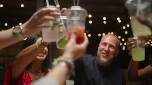 Multiracial People Clinking Glasses With Cocktails In Bar And Laughing Celebrations And Cheering