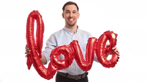 Smiling Man Holds Love Balloon on White Background