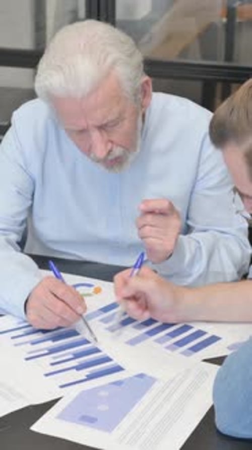 Business People Doing Paperwork in Office, vertical video