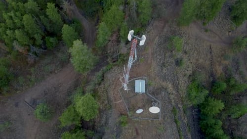 Looking down on Radio Communications Cell Tower Transmitter on a Remote Mountain. Satellite Dishes,