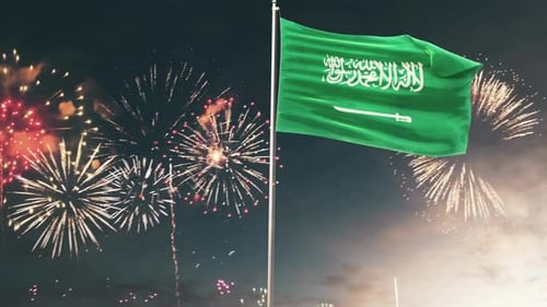 Saudi Arabia Flag Waving with Festive Fireworks Display