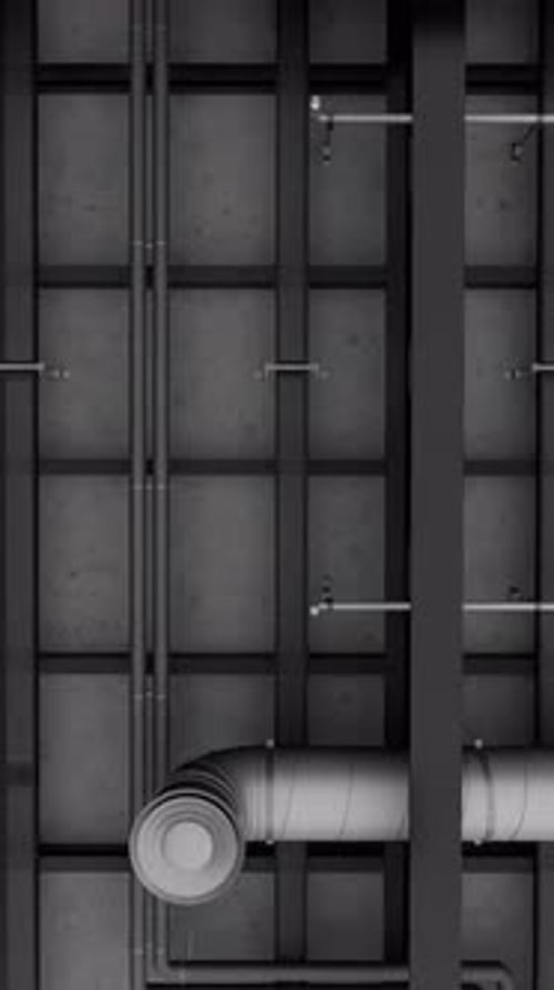 Electrical and ventilation systems, connections with cables and metal pipes inside a modern building