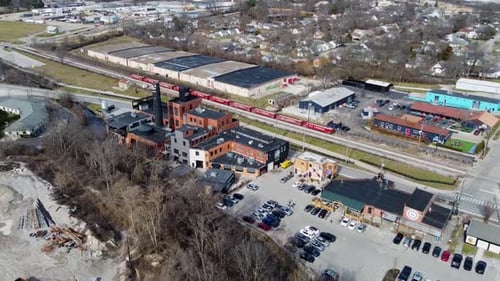 Drone shot of the Pepper Distillery District in Lexington, Kentucky pulling out and panning right.