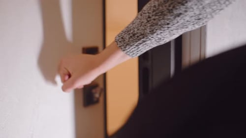 Close Up Hand Turning Door Handle to Leave Home
