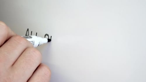 Hand Writes 'All or Nothing' on White Background
