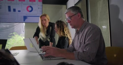 Business Team Working with Laptops in Modern Office