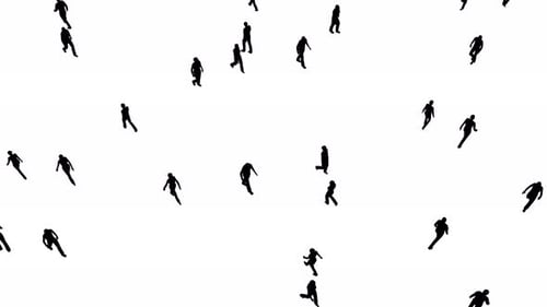 Silhouette of people in the city walking. There are men and women walking among the business crowd.