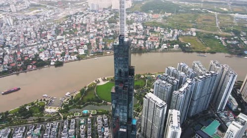 Aerial shot of Landmark 81 with Saigon River at sunrise in the morning.