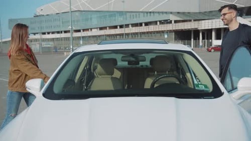 A Stylish White Car is Parked Beautifully in a Modern and Elegant Parking Lot for Various Vehicles
