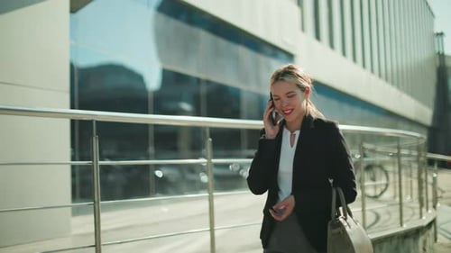 Professional Business Lady Smiling on Phone Call While Walking Home Urban Area