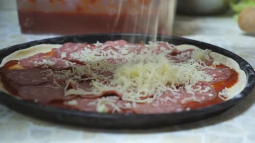 Making Pizza with Salami and Cheese at Home