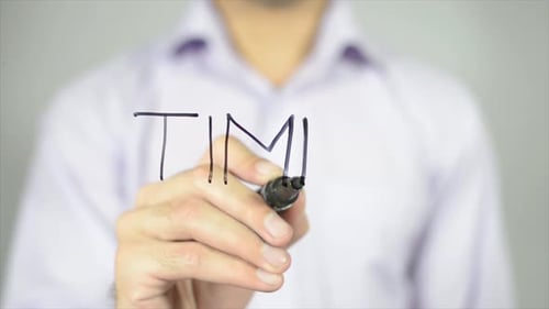 Hand Writing Time with a Black Marker