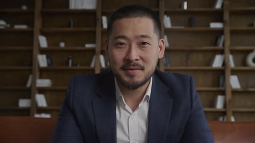 Confident Man Wearing Suit in Office Setting