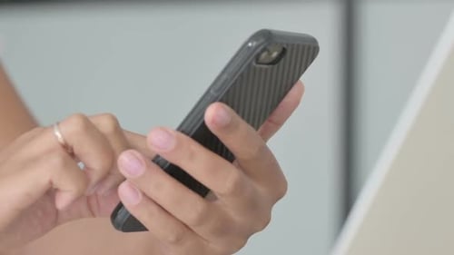 Close Up of Female Hand Using Smartphone