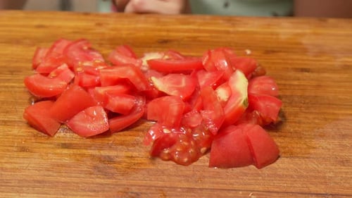 Diced Red Tomatoes on Wooden Cutting Board Close-Up