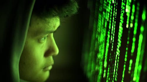Cybersecurity Hacker Close Asian Man Matrix Green Code Screen Reflection Screen Sweat Programmer View