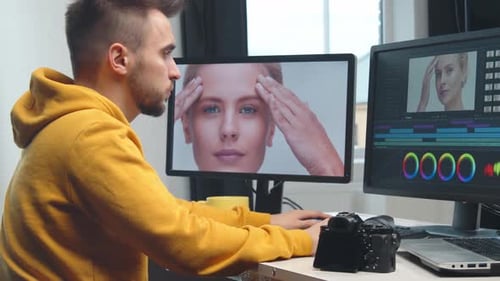 Freelance Videographer Colorist Editing Footage Using Professional Software Monitor and Montage