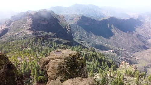 Mountain landscape in Roque Nublo during a misty morning in Gran Canary Island, Spain. Aerial drone